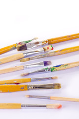 Obraz premium Used paint brushes of different colors
