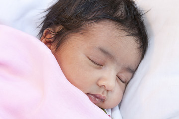 Obraz na płótnie Canvas Portrait of a Sleeping Newborn Baby Girl