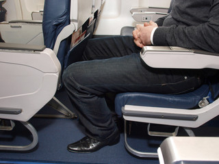 Lack of legroom on plane - obrazy, fototapety, plakaty