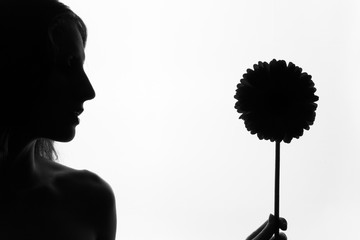 The girl with the big flower on a white background