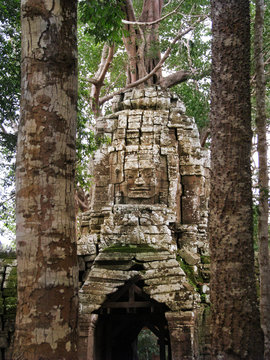 Smiling faces of ancient kings at the temples of Angkor Wat