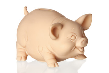 Piggy bank with reflection on the floor