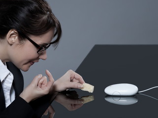 beautiful business woman playing with her computer mouse