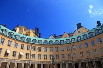 Fototapeta na wymiar Big old yellow architecture in Stockholm, Sweden.