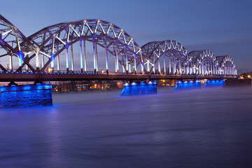 Blue railway bridge at sunset