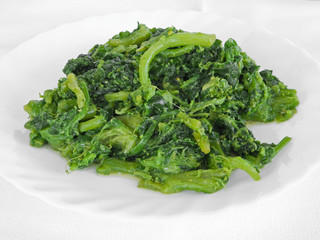 Boiled turnips on white dish.