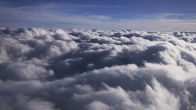 Flying over clouds in plane - HD