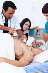 A diverse medical team resuscitating a patient