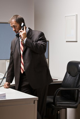 Businessman talking on telephone