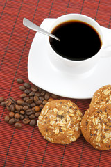 Coffee with cookies on red background