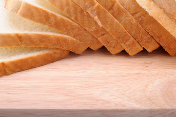 Several slices of bread on cutting board