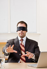 Businessman in blindfold