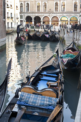 Fototapeta na wymiar Gondolas in a big canal in Venice, Italy