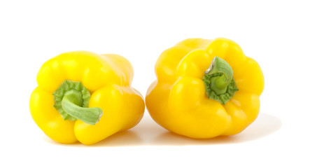 Yellow bell peppers isolated on white background.