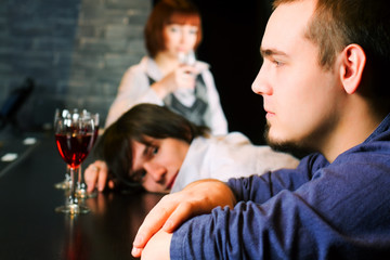 Young men relaxing in a bar.