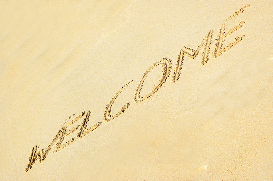 Welcome Written In Sand