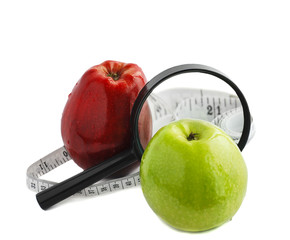 Apples and Magnifier isolated on white