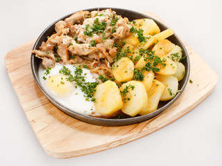 Meat plate with potatoes.
