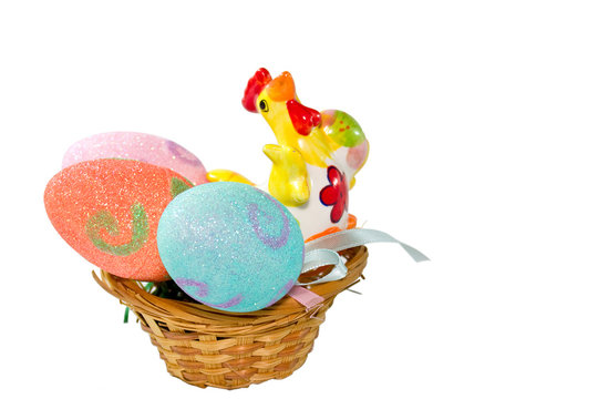 Hen and Easter eggs in basket