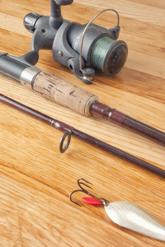Rod with minnow (lure) on wood desk