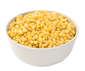boiled yellow peas in a bowl close-up isolated