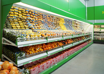 Shelf with citrus fruits in supermarket