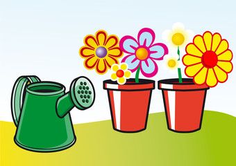 macetas con flores y regadera © idea