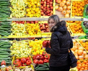 Beautiful young woman shopping for fruits and vegetables
