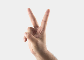 male hand with two fingers up in the peace or victory symbol