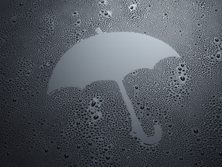Regenschirm auf schwarzem Hintergrund mit Wassertropfen
