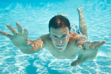 Man swimming under water