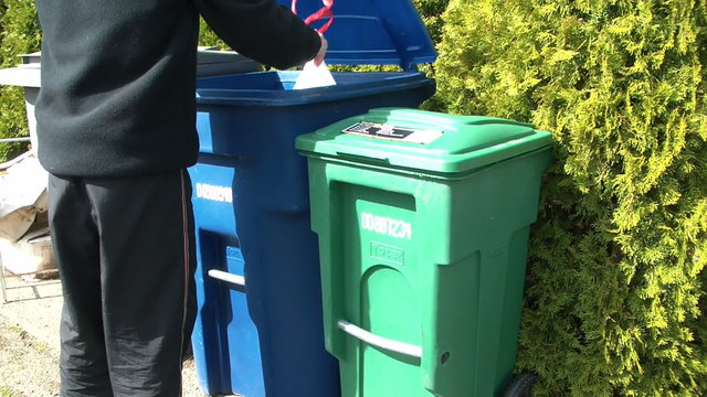 Trashing a bag of waste