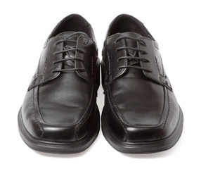 Pair of black shoes isolated on white