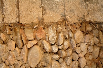 Golden masonry stone wall from old building