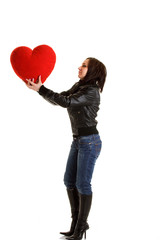 Girl with big red heart pillow