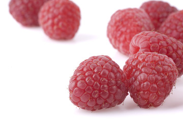 Raspberries on a white background