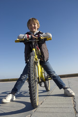 Boy on a bike on the promenade