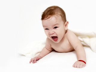 Portrait of the little boy under a terry towel