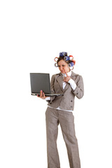 Business woman with curlers and laptop