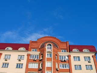 new colorful yellow building, red roof