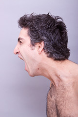 Fototapeta premium Angry young man screaming