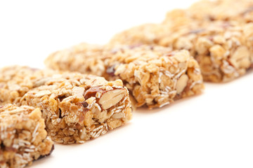 Obraz premium Row of Several Granola Bars Isolated on White