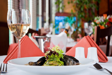 Trout baked with the spice served with tinned courgettes