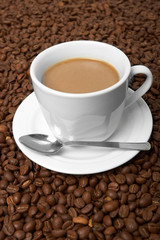 Cup with coffee, costing on coffee grain