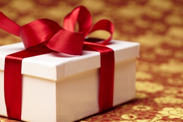Gift decorated with a tape and a bow