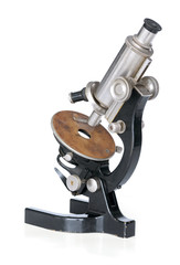 old scientific microscope isolated over white