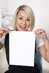Fototapeta premium Beautiful woman presenting white card