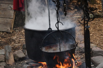 Pots cooking over an open fire