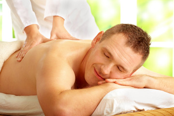 Obraz na płótnie Canvas Male enjoying massage treatment