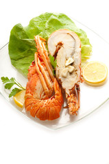 cutted lobster with lettuce and lemon